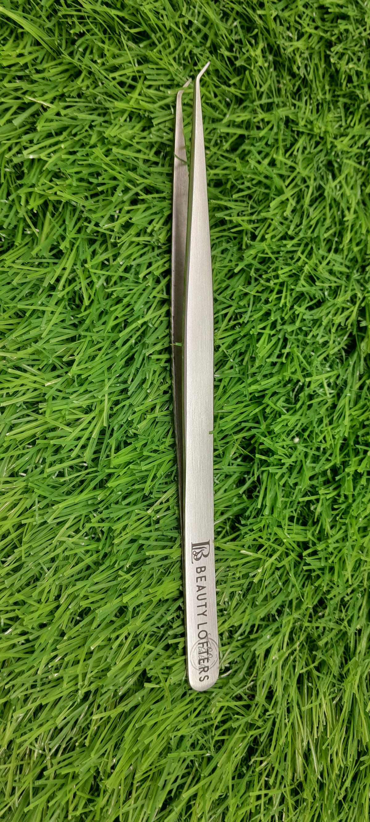 Beauty Lofters 45° Angled Slim 14cm Silver Tweezer – vertical front view with branding
