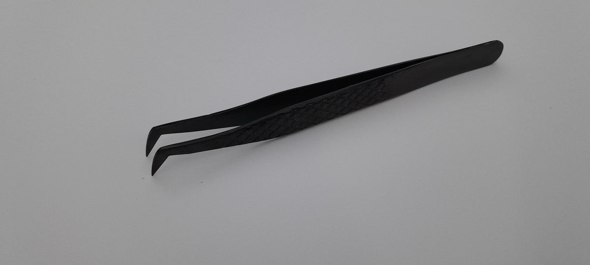 Plasma black boot tweezer with diamond grip, angled view