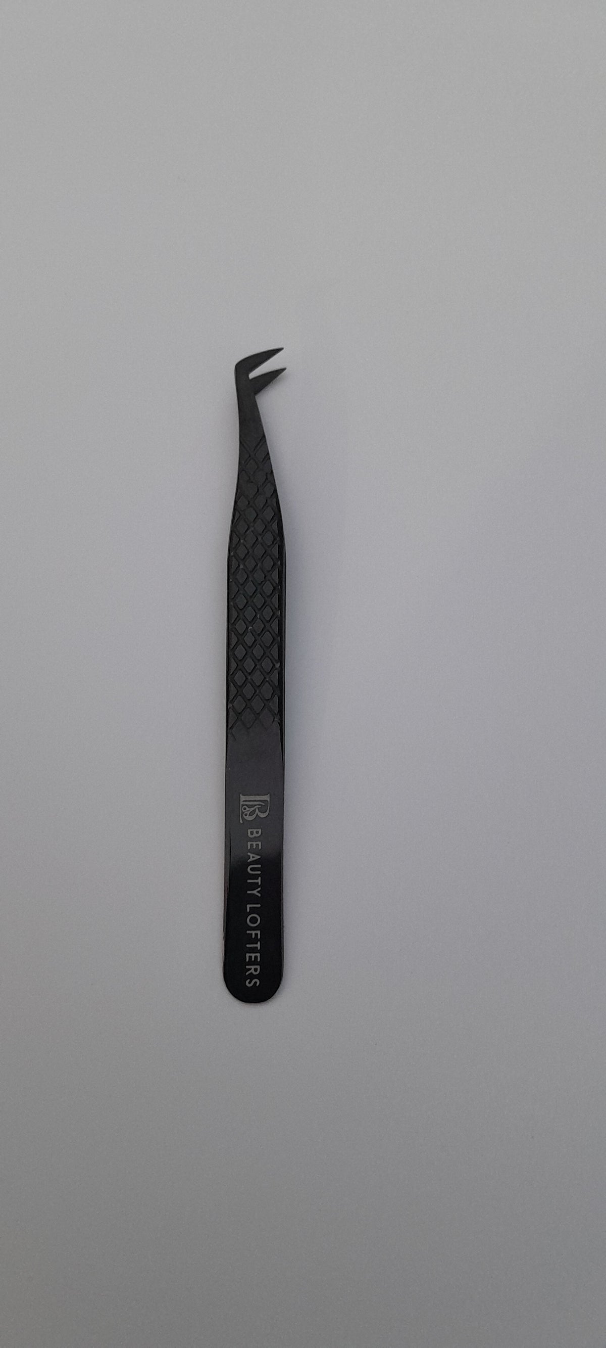 Diamond Grip Boot Tweezer in plasma black showing angled boot tip