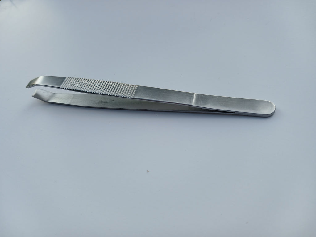 Beauty Lofters big slant tweezer showing slanted tip and textured handle