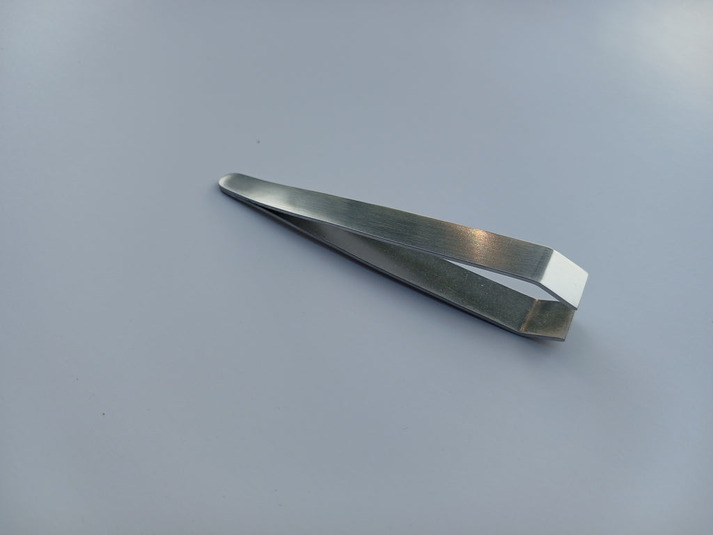 Beauty Lofters Medium Slant Tweezer in stainless steel, side view